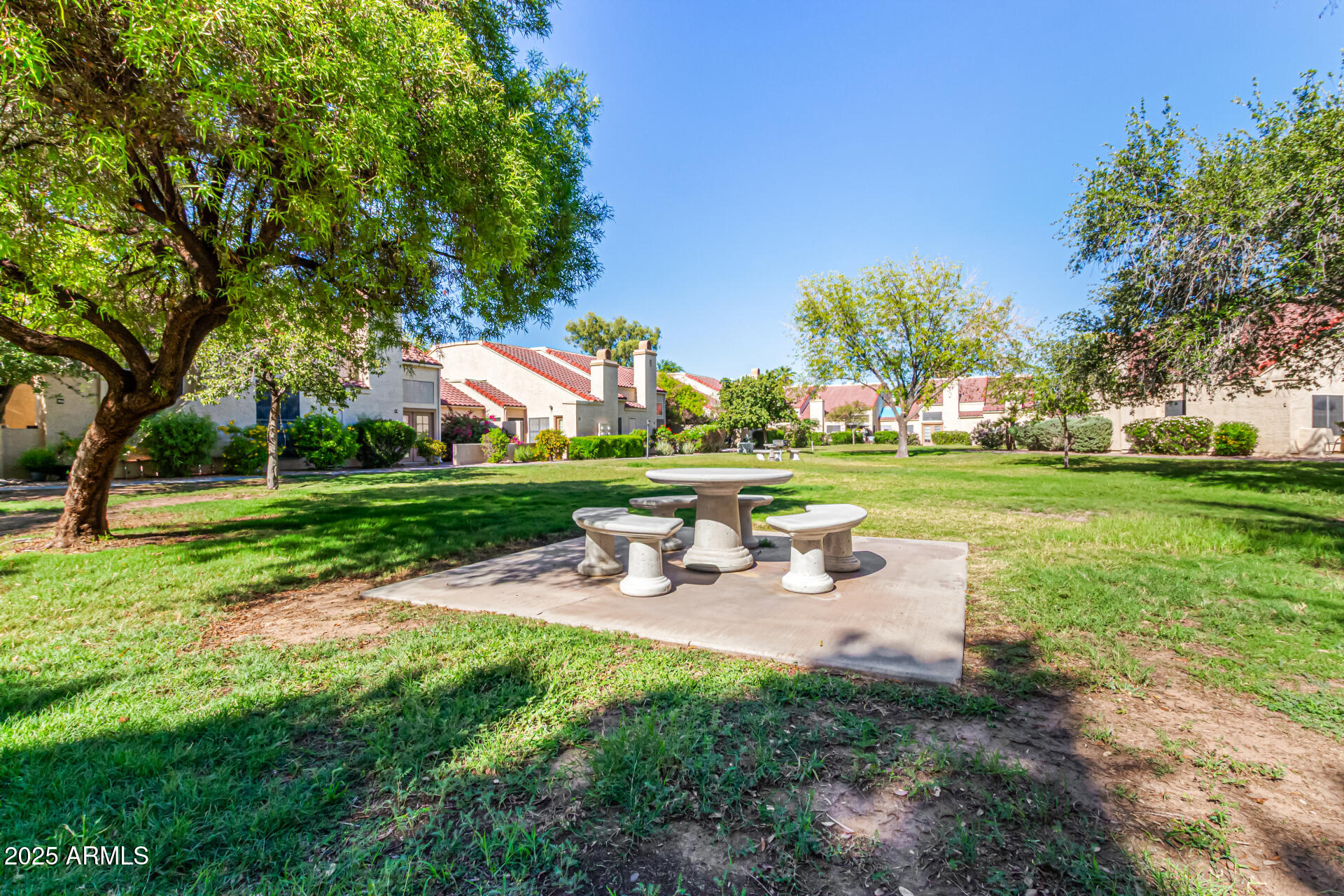 602 North May, Unit 49 Mesa, AZ 85201 - Photo 28 of 32 a view of a park with bench and trees