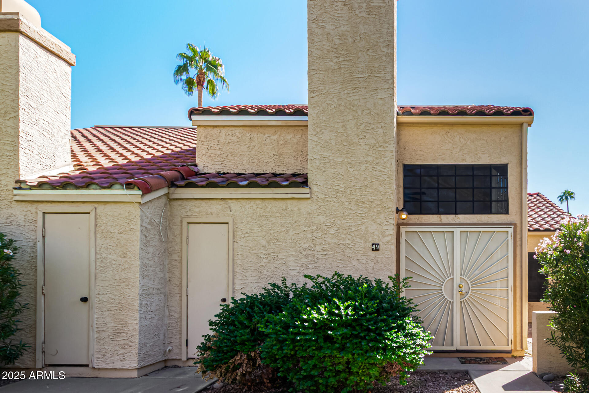 602 North May, Unit 49 Mesa, AZ 85201 - Photo 3 of 32 front view of a house with a potted plant