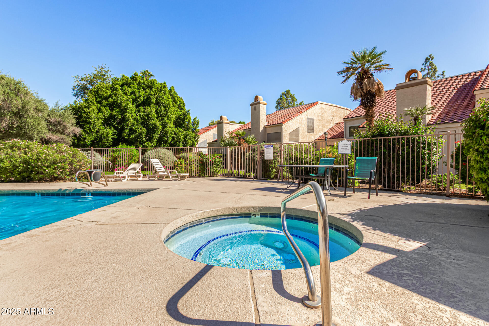 602 North May, Unit 49 Mesa, AZ 85201 - Photo 31 of 32 a view of a swimming pool with a patio and a yard