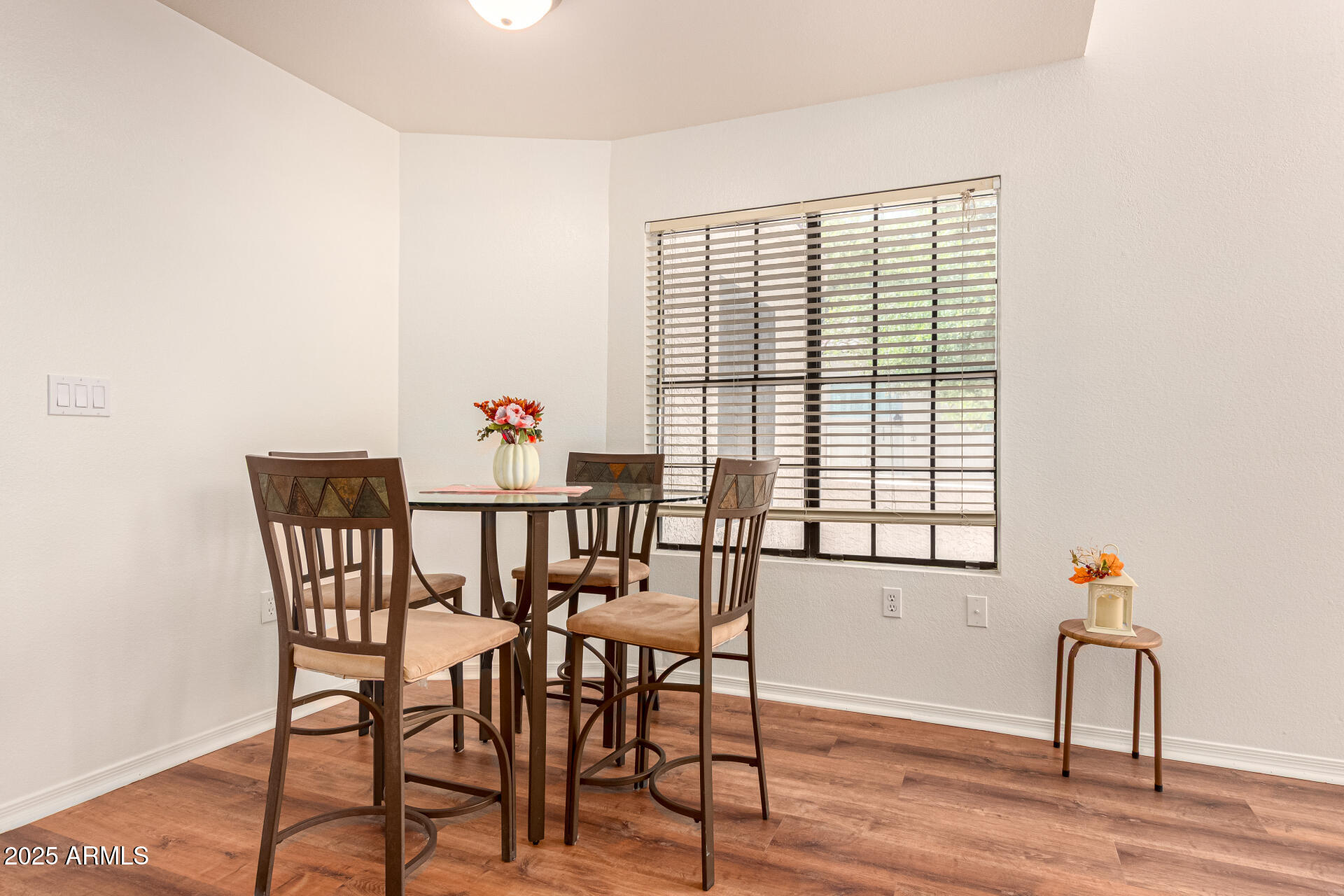 602 North May, Unit 49 Mesa, AZ 85201 - Photo 9 of 32 a view of a dining room with furniture window and wooden floor