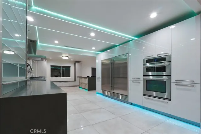 a view of a livingroom with furniture and staircase