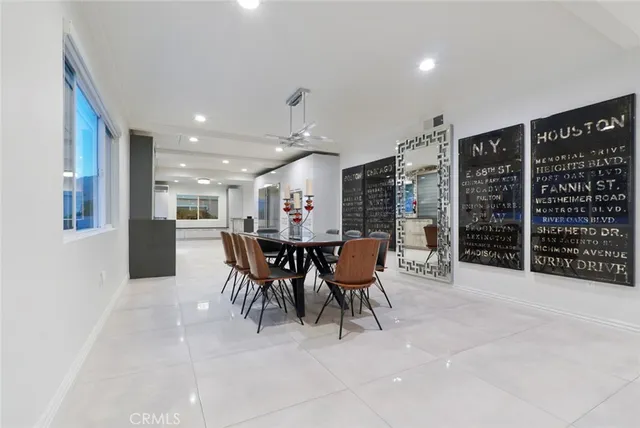 a view of kitchen with refrigerator and window