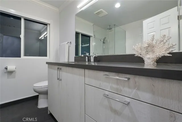 an empty room with wooden floor and furniture