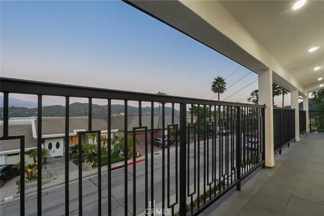 a view of a balcony with an outdoor space