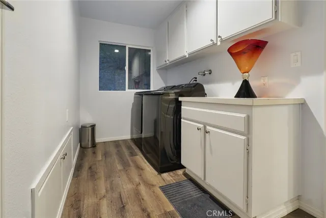 a kitchen with a sink a stove and a microwave