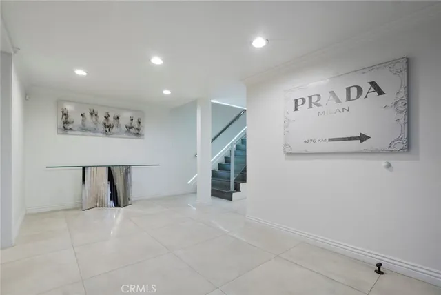 a terrace with a sink and a mirror