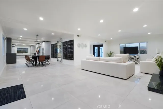 a very nice looking dining room with a large mirror