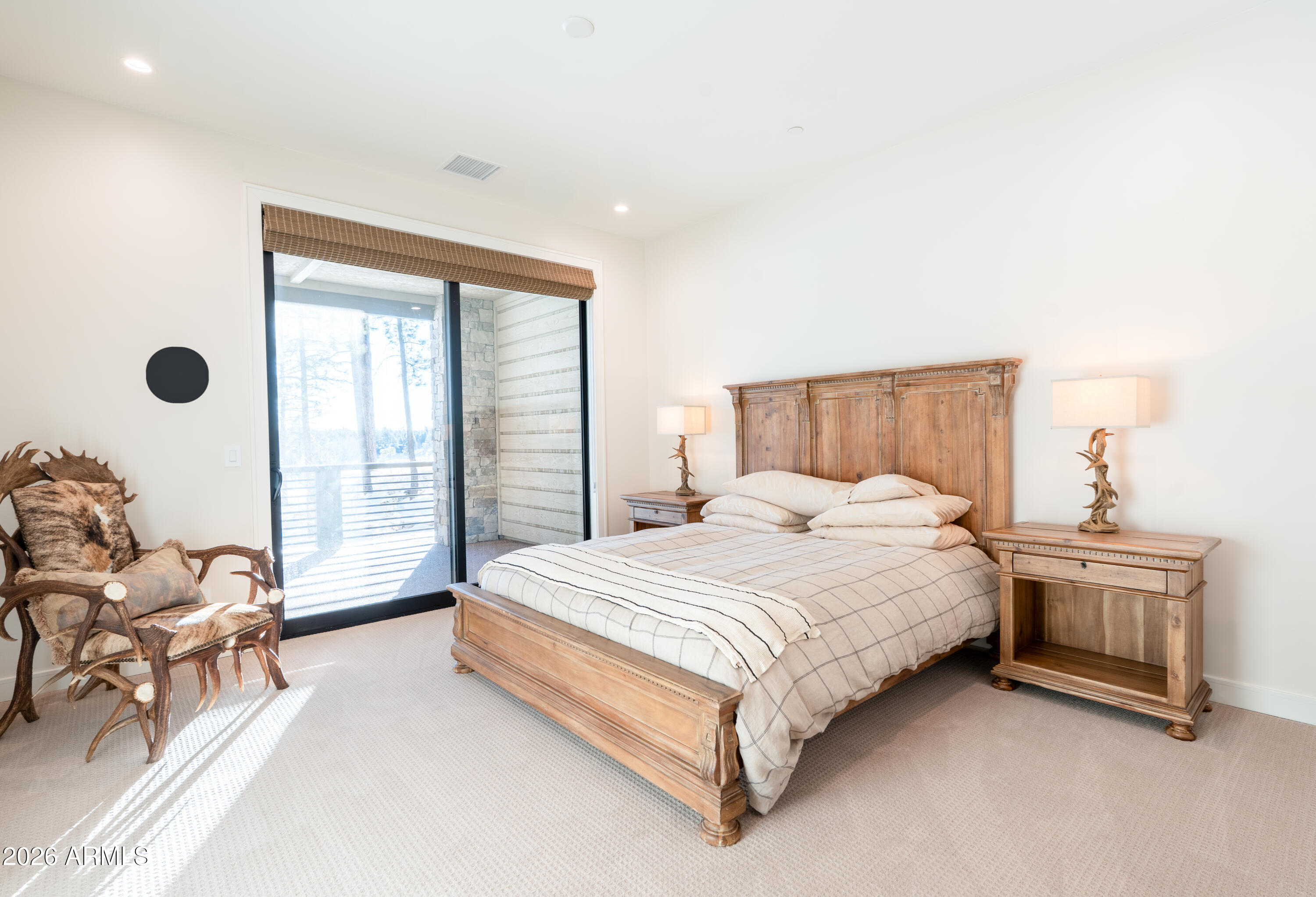 1733 East Bent Tree Circle, Unit 45 Flagstaff, AZ 86005 - Photo 11 of 37 a spacious bedroom with a bed and a large window