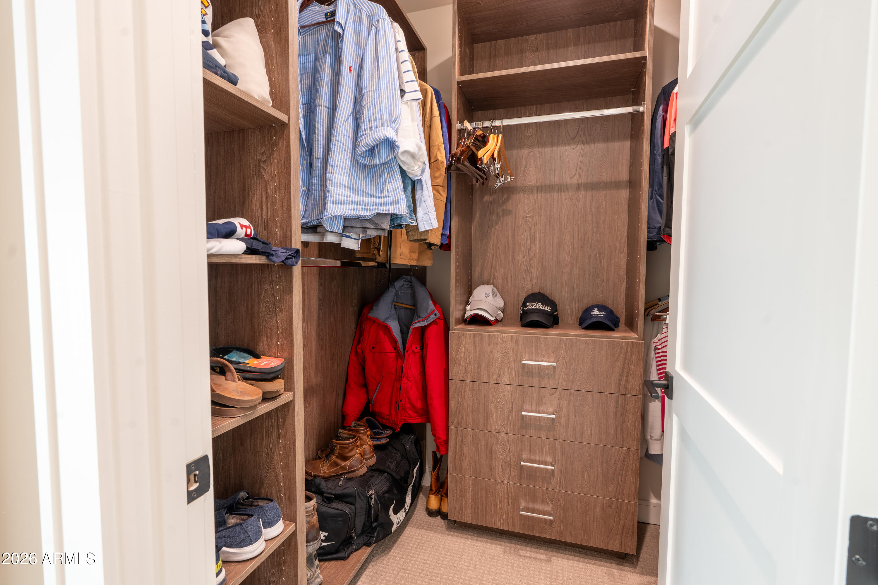 1733 East Bent Tree Circle, Unit 45 Flagstaff, AZ 86005 - Photo 14 of 37 a view of walk in closet with clothes and shoes
