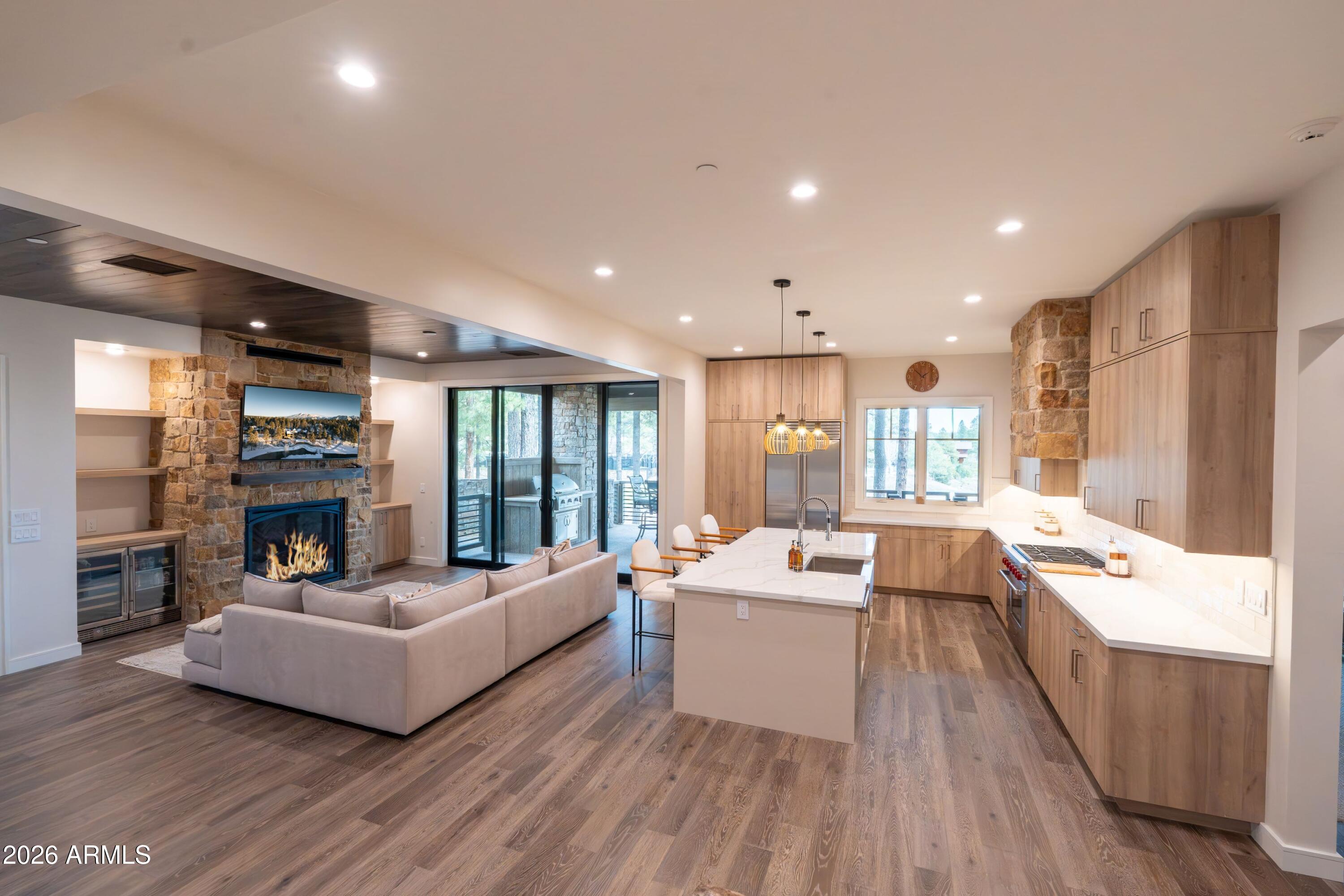 1733 East Bent Tree Circle, Unit 45 Flagstaff, AZ 86005 - Photo 2 of 37 a living room with furniture and a fireplace