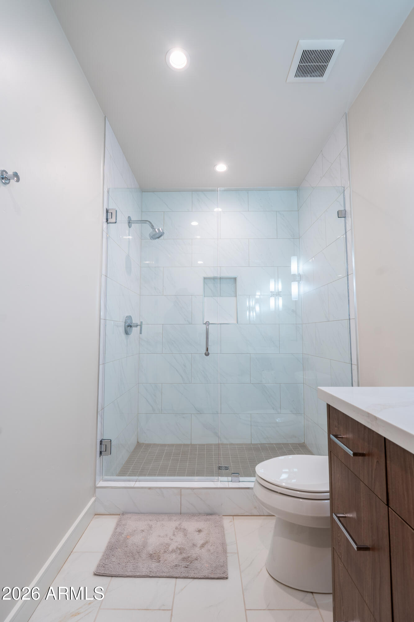 1733 East Bent Tree Circle, Unit 45 Flagstaff, AZ 86005 - Photo 22 of 37 a bathroom with a toilet a sink and shower