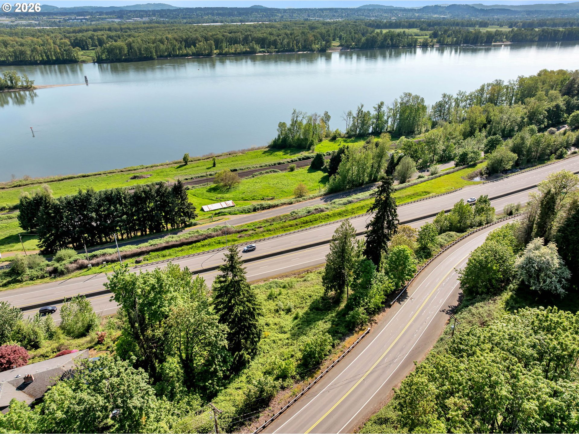 560 Northwest Brady Road Camas, WA 98607 - Photo 7 of 27 a view of a lake with a house in the background