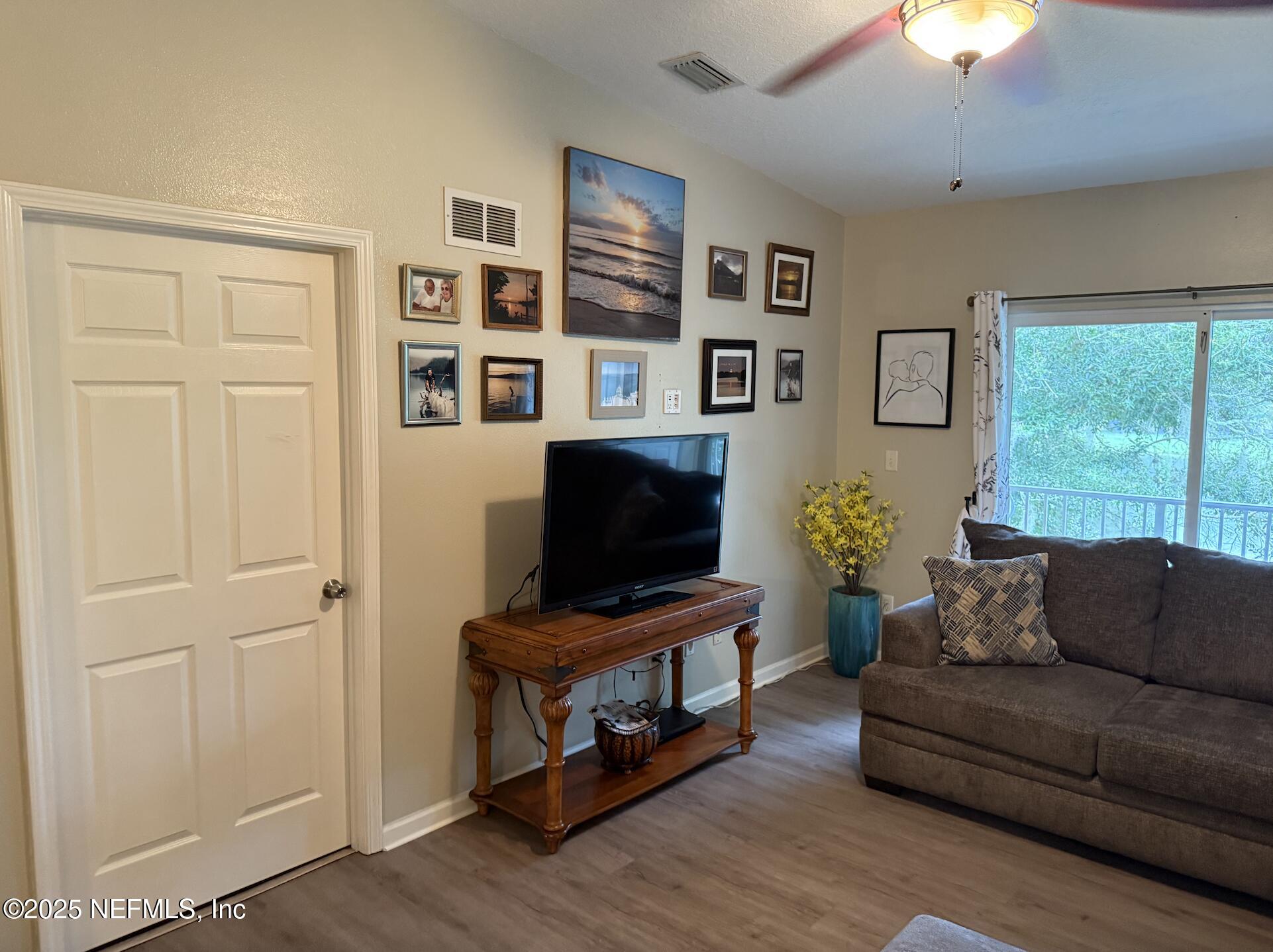 264 Golden Lake Loop, Unit 264 St. Augustine, FL 32084 - Photo 4 of 18 a living room with furniture and a flat screen tv
