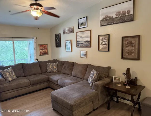 a living room with furniture and a window