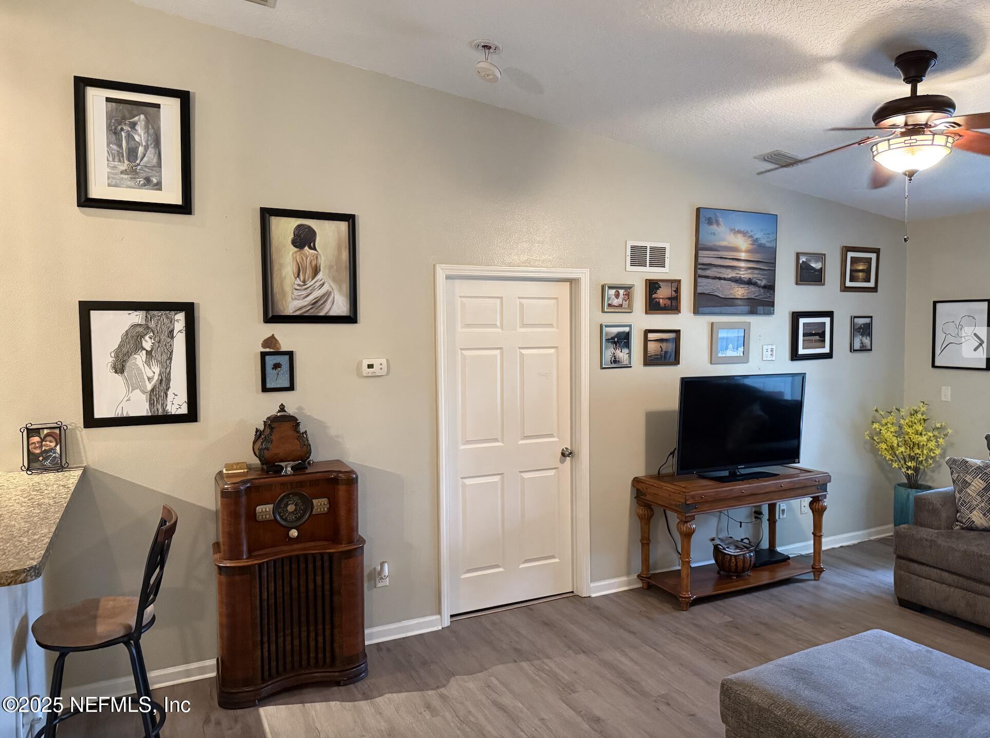 264 Golden Lake Loop, Unit 264 St. Augustine, FL 32084 - Photo 6 of 18 a view of a workspace with furniture and wooden floor