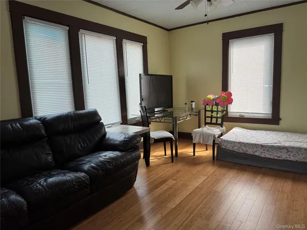 a bathroom with a granite countertop shower and a sink