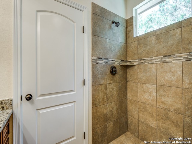192 Weatherby Drive, Unit A Spring Branch, TX 78070 - Photo 19 of 25 a bathroom with a shower