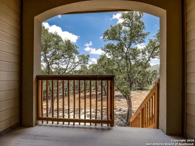 a view of empty space with large trees