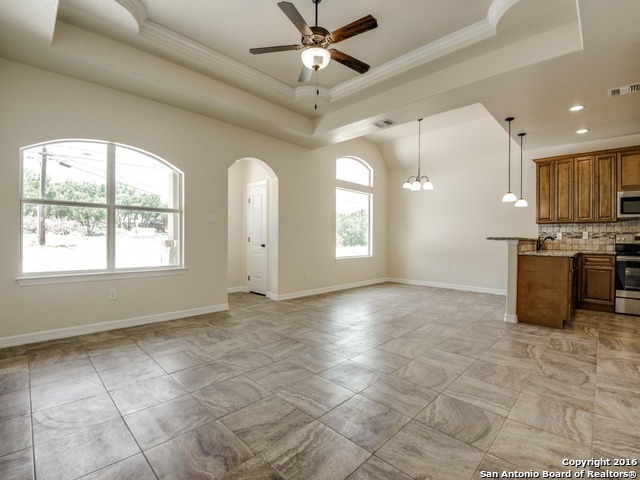 192 Weatherby Drive, Unit A Spring Branch, TX 78070 - Photo 6 of 25 a view of a kitchen with microwave and windows