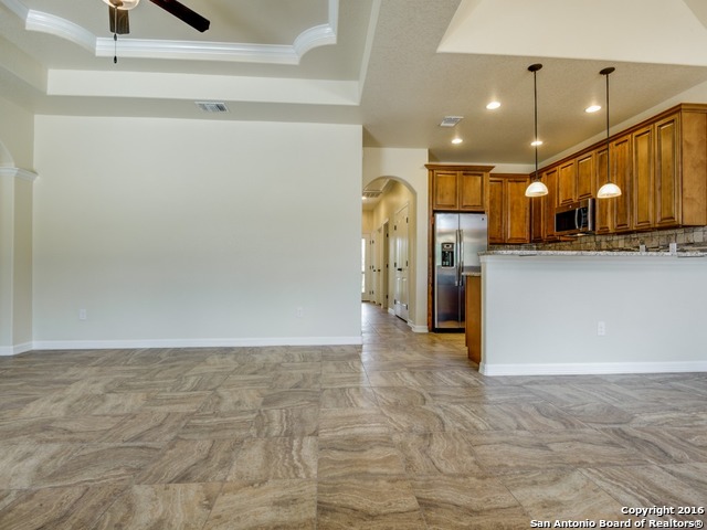 192 Weatherby Drive, Unit A Spring Branch, TX 78070 - Photo 8 of 25 a view of a kitchen with a refrigerator and a sink