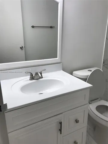 a bathroom with a sink and a toilet