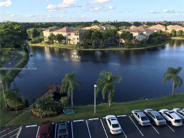 an aerial view of a house with a lake view