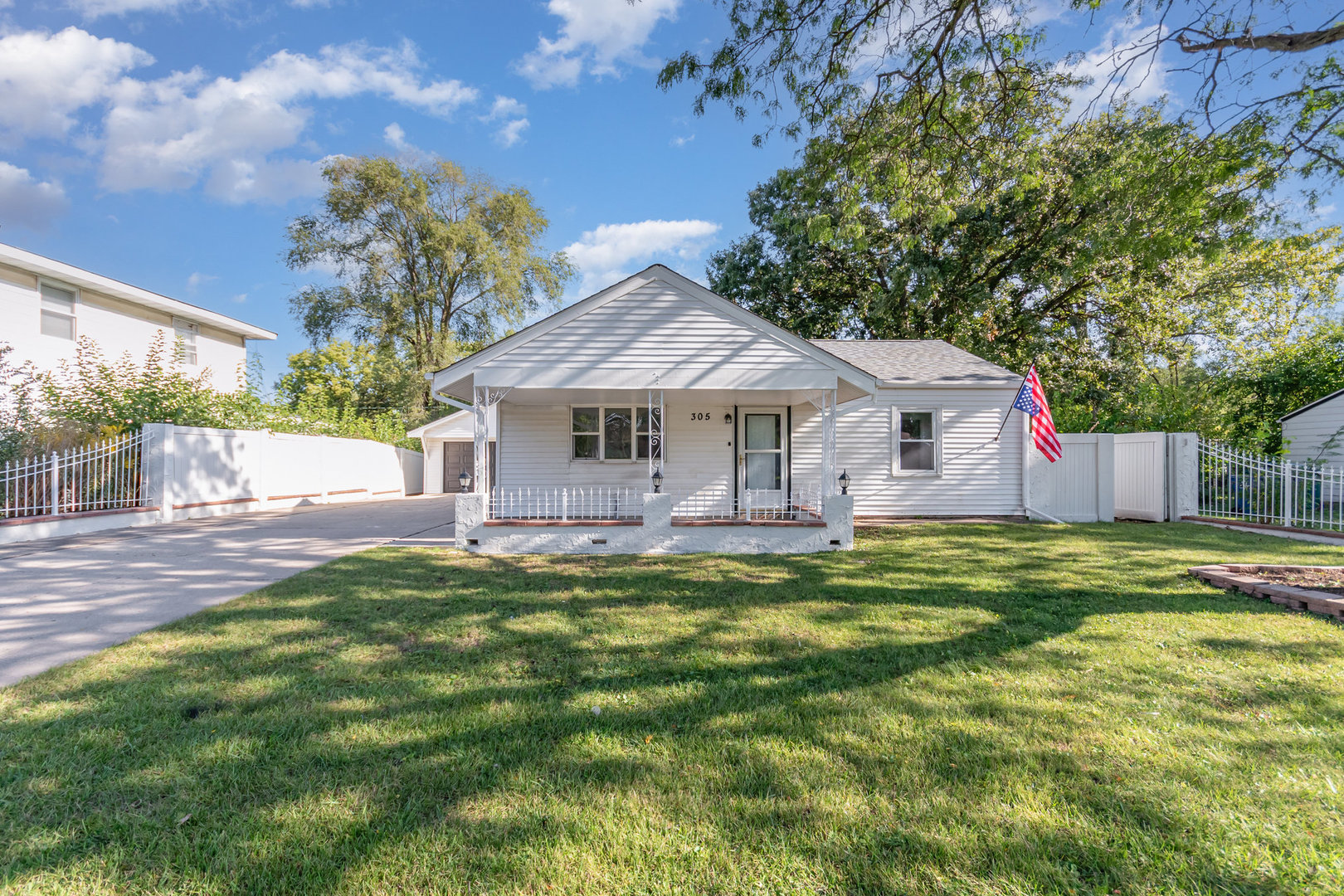 305 Luana Road Joliet, IL 60433 - Photo 1 of 16 a front view of a house with garden