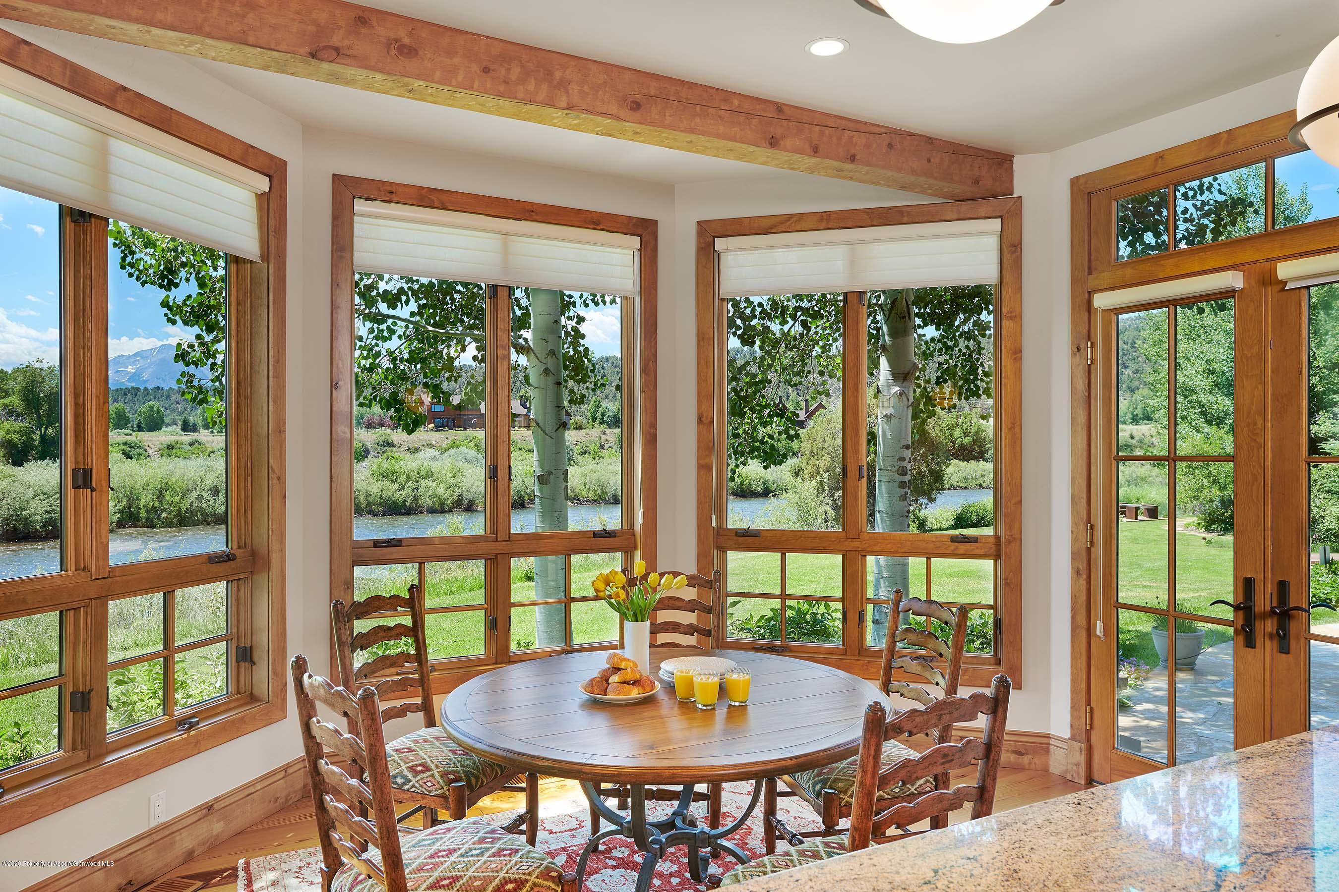 318 River's Bend Carbondale, CO 81623 - Photo 13 of 39 a dining room with furniture window and outside view
