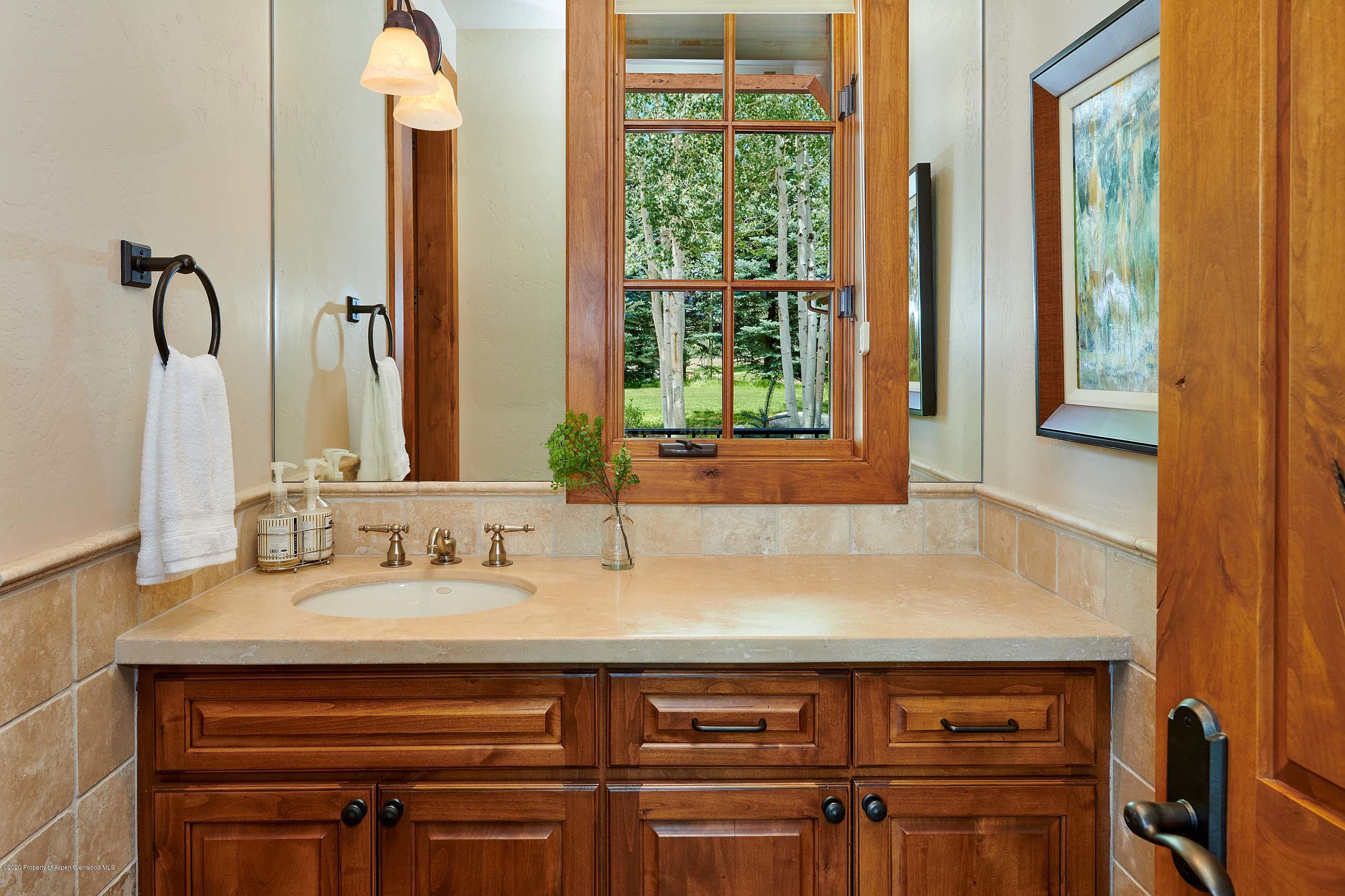 318 River's Bend Carbondale, CO 81623 - Photo 24 of 39 a bathroom with a sink and a mirror