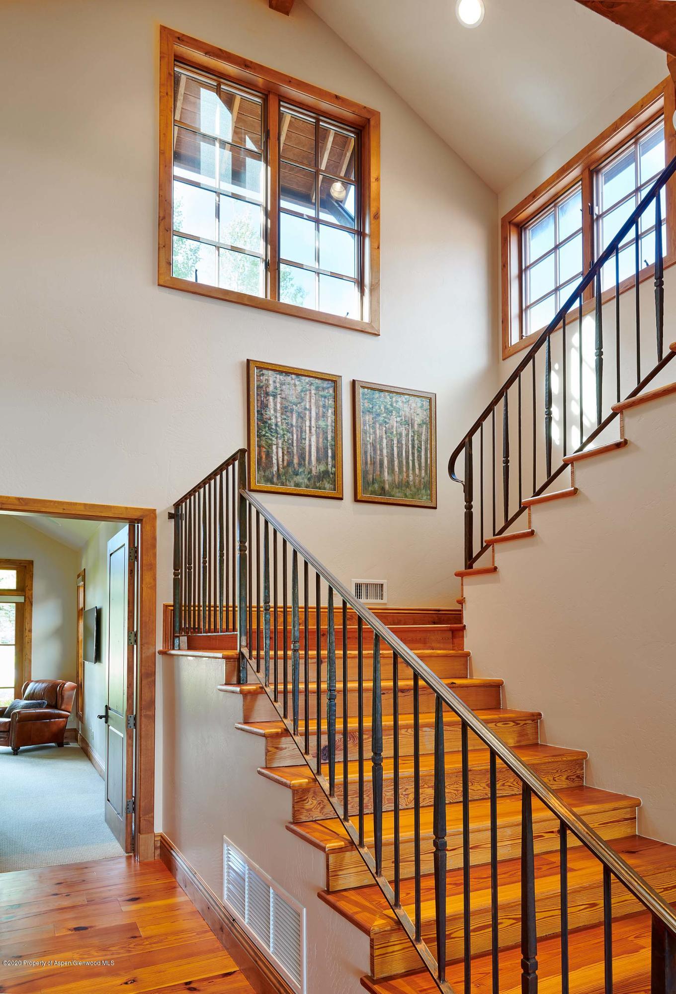 318 River's Bend Carbondale, CO 81623 - Photo 29 of 39 a view of staircase with lots of frames on wall and a window
