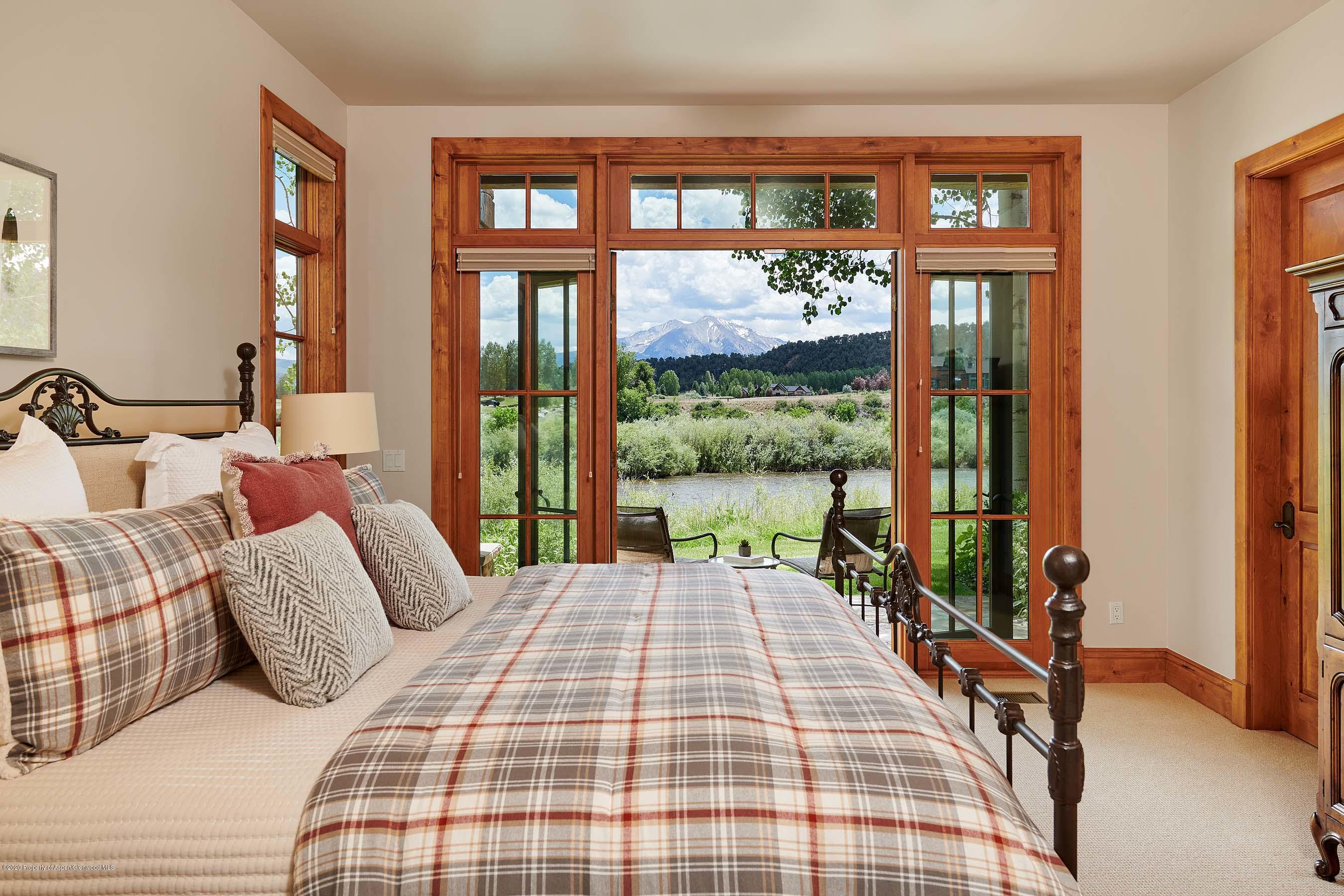 318 River's Bend Carbondale, CO 81623 - Photo 35 of 39 a bedroom with a bed and a large window