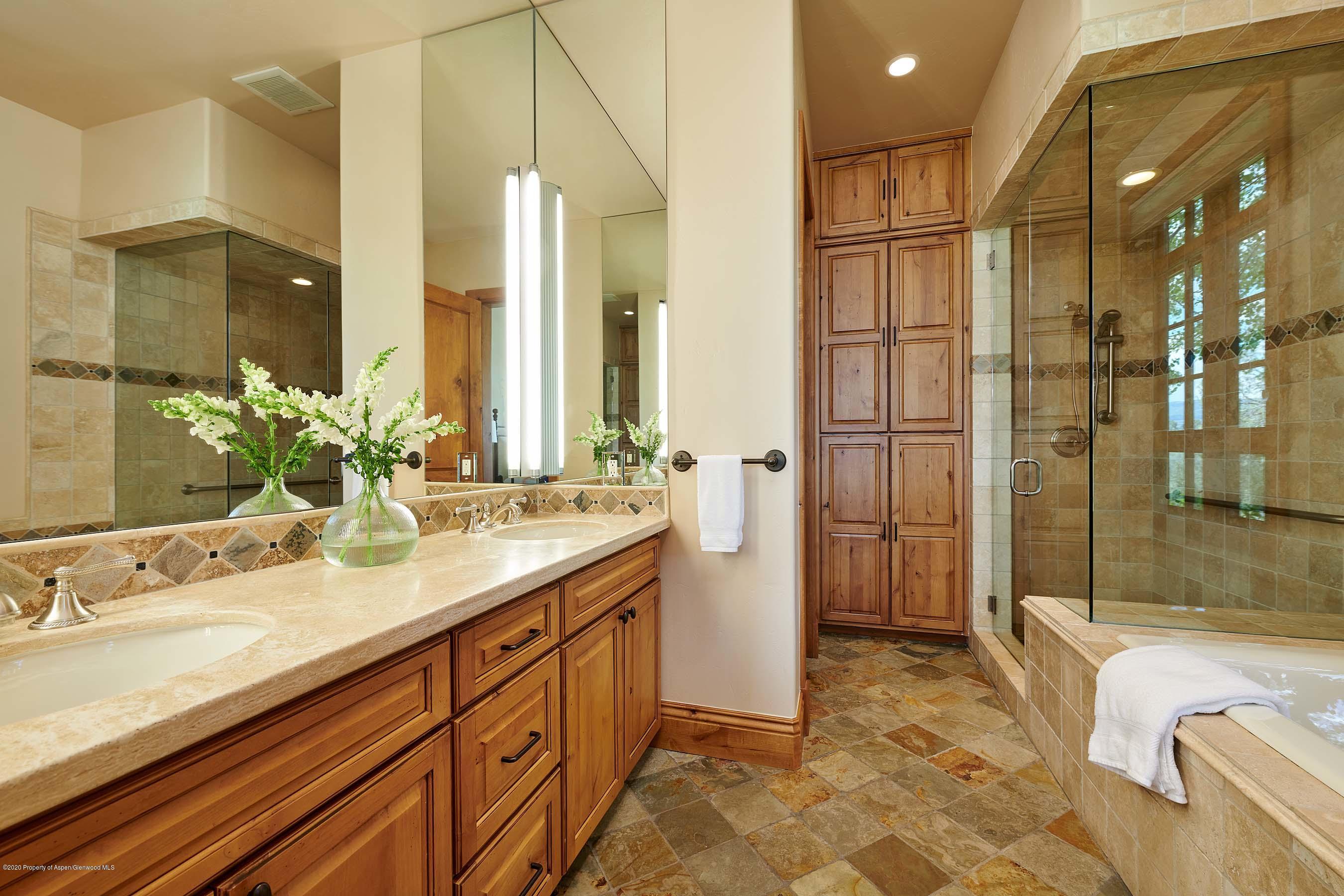 318 River's Bend Carbondale, CO 81623 - Photo 37 of 39 a spacious bathroom with a double vanity sink a mirror and a bathtub