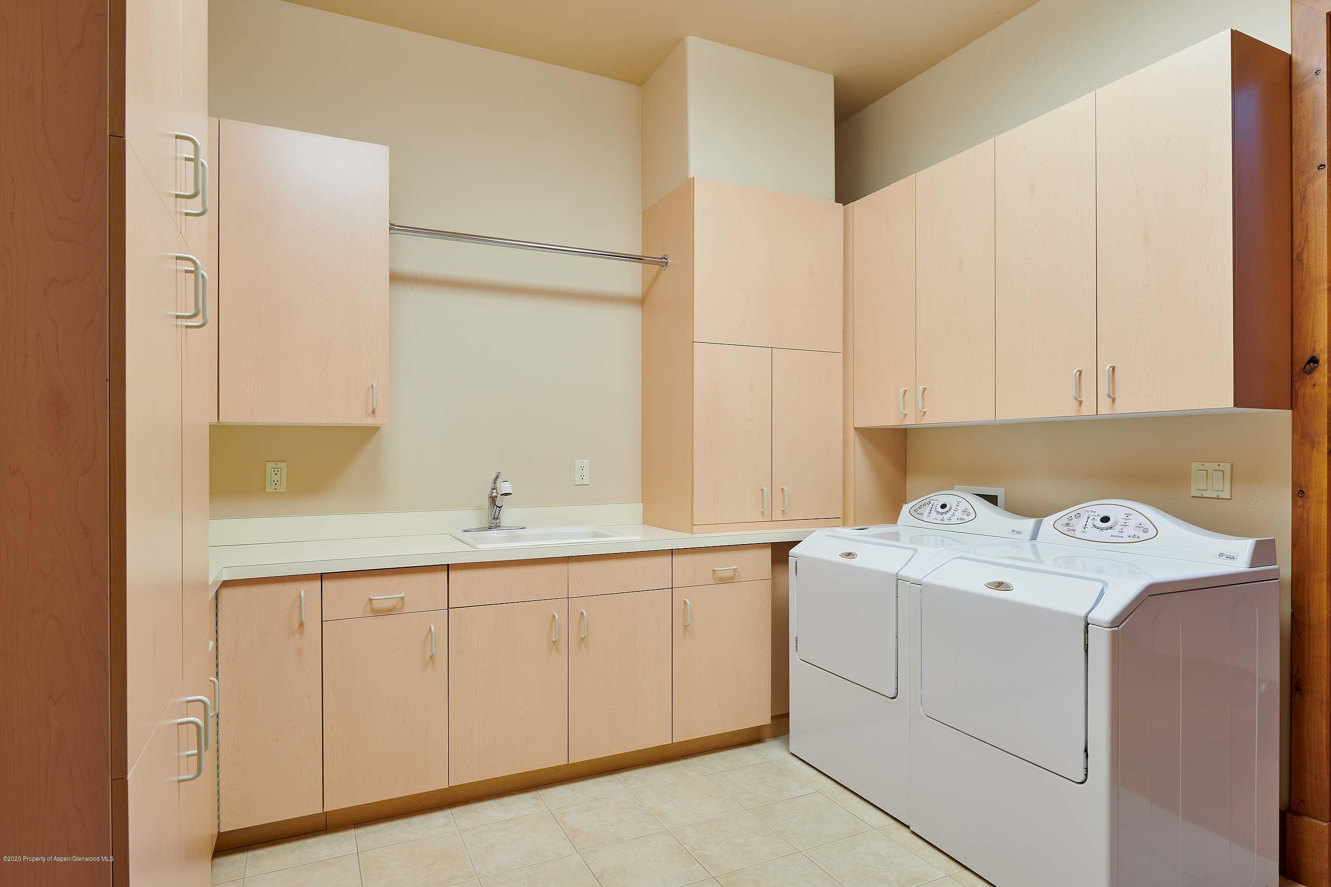 318 River's Bend Carbondale, CO 81623 - Photo 39 of 39 a utility room with a sink washer and dryer