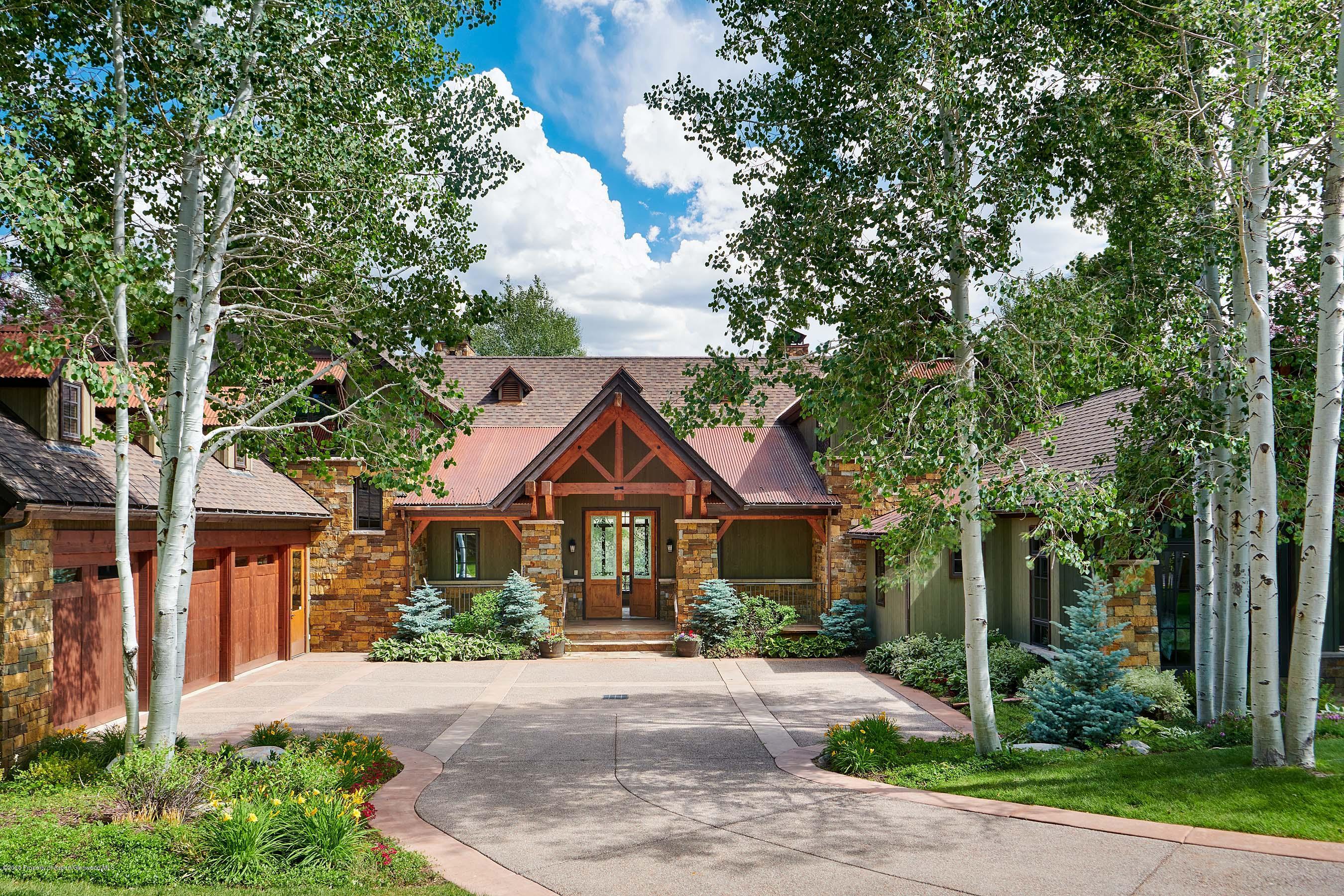318 River's Bend Carbondale, CO 81623 - Photo 4 of 39 a front view of a house with a yard and trees