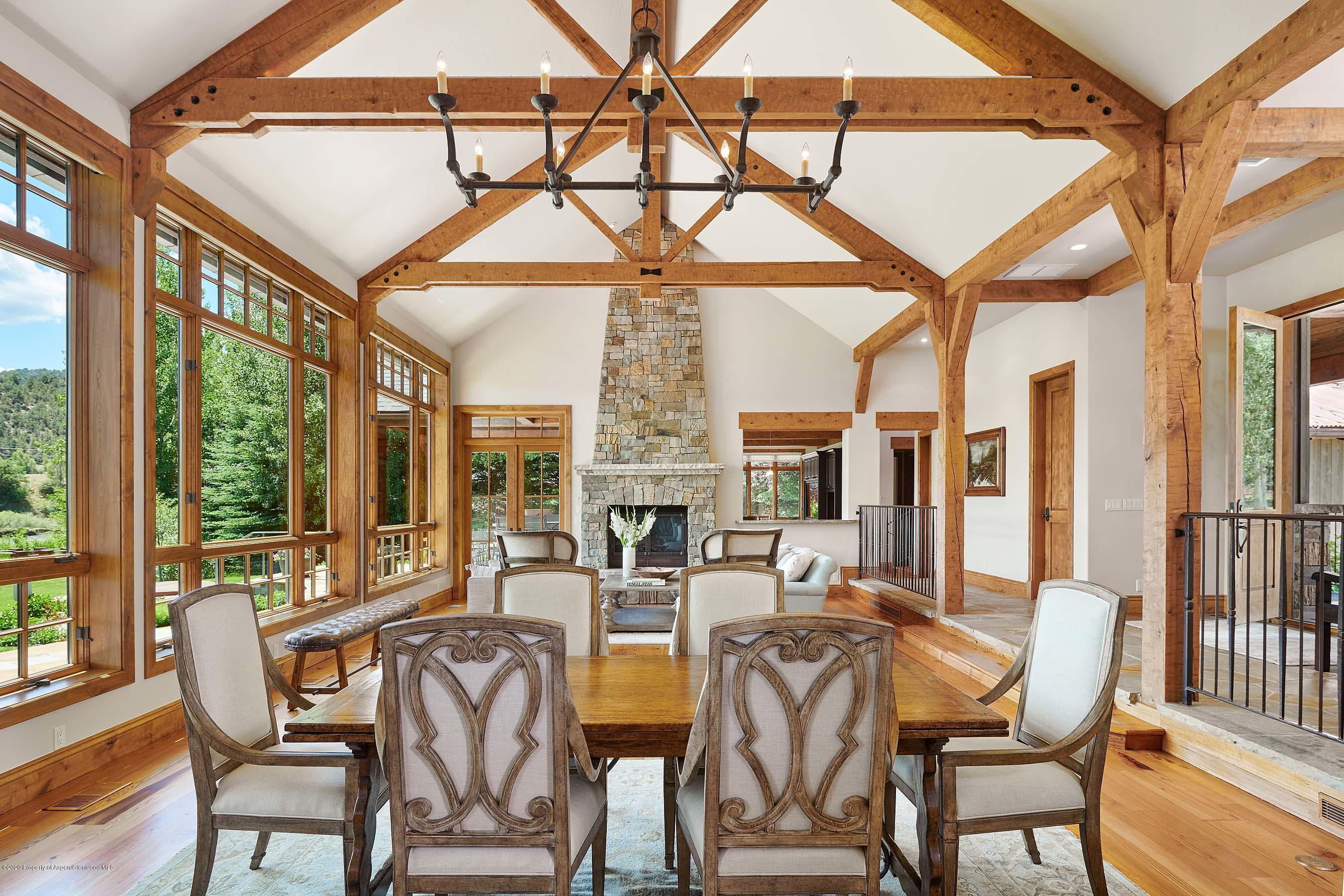 318 River's Bend Carbondale, CO 81623 - Photo 6 of 39 a dining room with furniture a chandelier and wooden floor