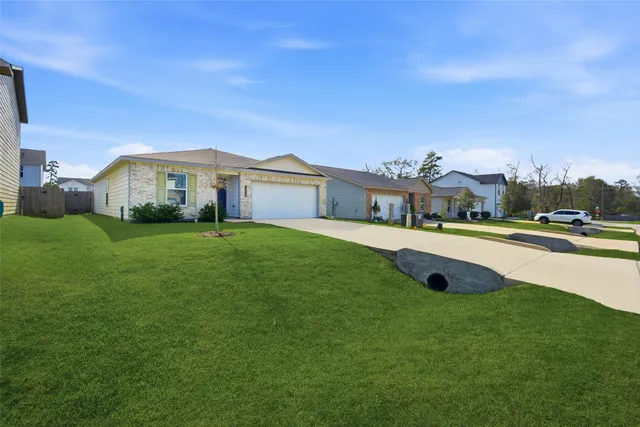 a view of a house with a big yard