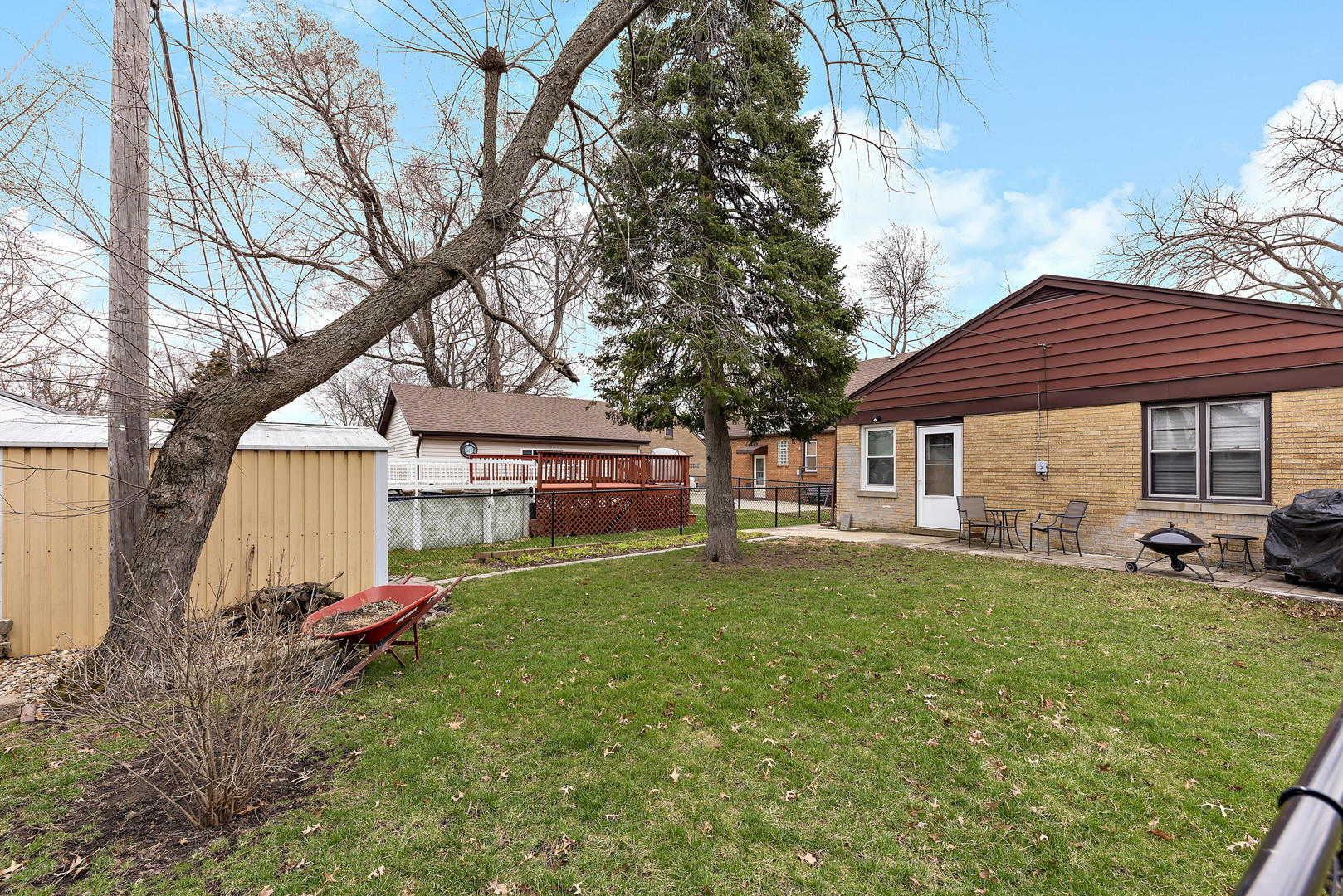 377 Cass Street Crete, IL 60417 - Photo 14 of 14 a front view of a house with a garden and trees