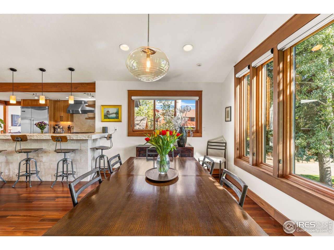 2545 Tamarack Avenue Boulder, CO 80304 - Photo 11 of 40 a view of living room and kitchen with wooden floor