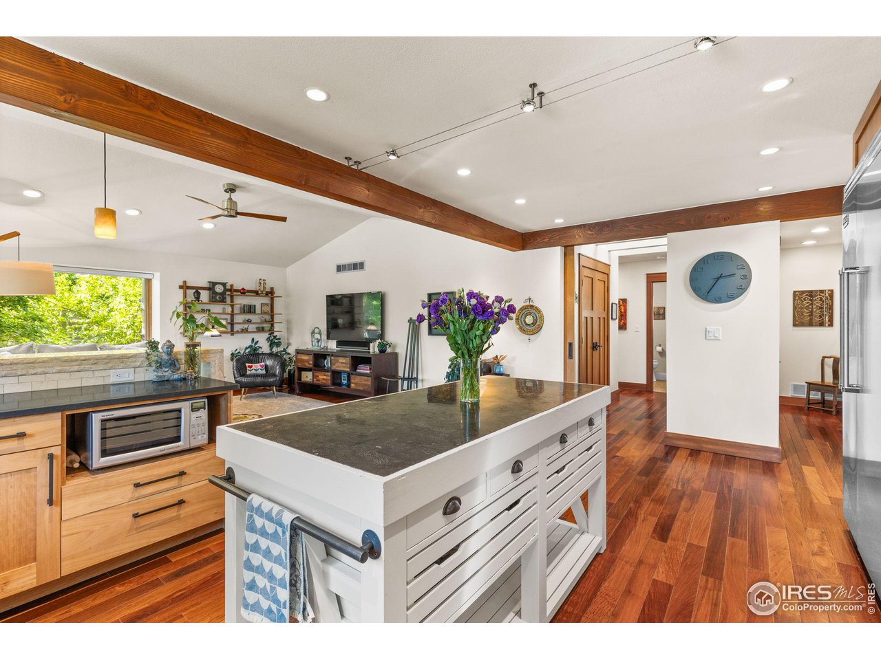 2545 Tamarack Avenue Boulder, CO 80304 - Photo 15 of 40 a kitchen with stainless steel appliances kitchen island granite countertop a sink and a refrigerator