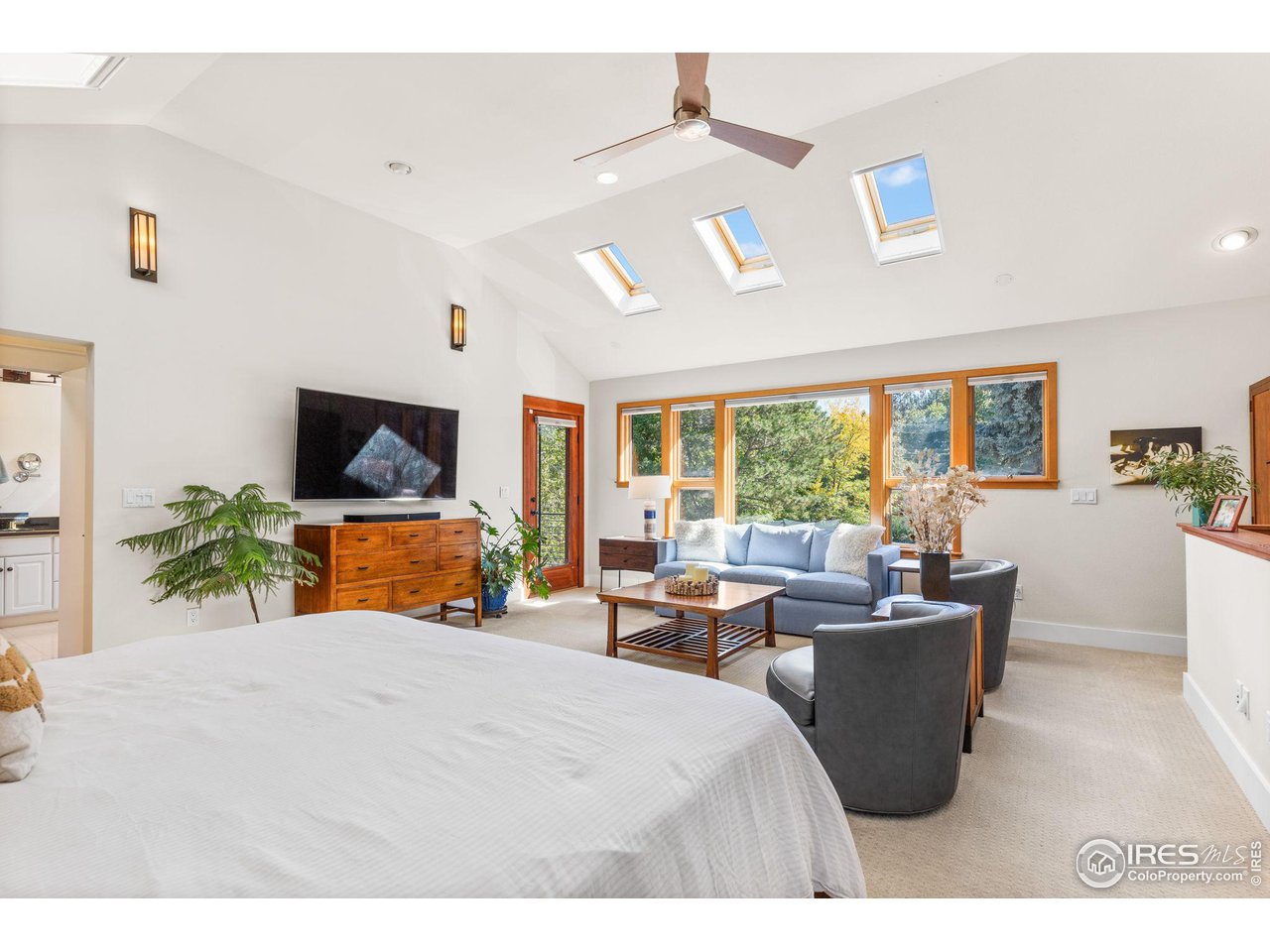 2545 Tamarack Avenue Boulder, CO 80304 - Photo 18 of 40 a bed room with furniture and a flat screen tv
