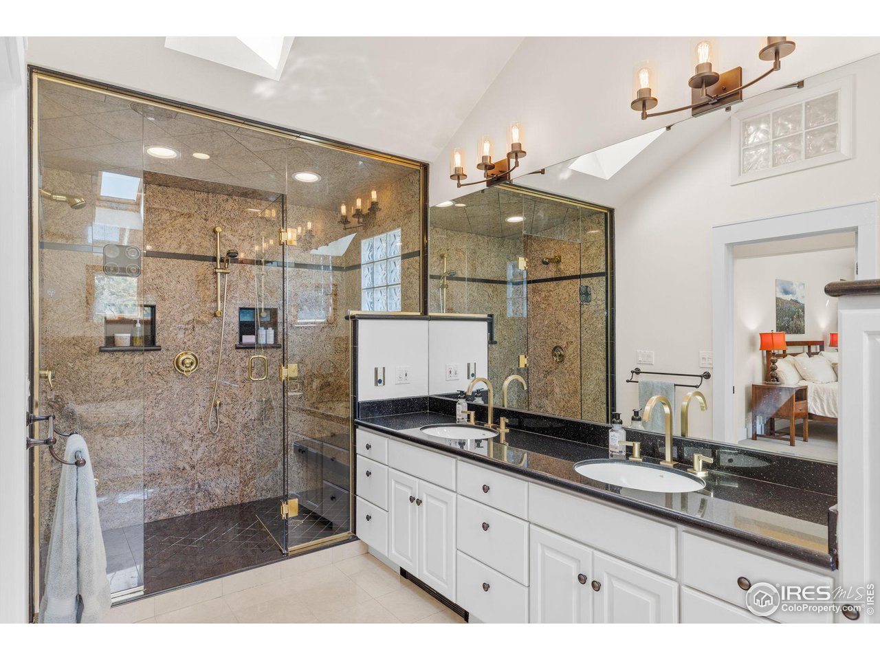 2545 Tamarack Avenue Boulder, CO 80304 - Photo 21 of 40 a bathroom with a double vanity sink mirror and shower