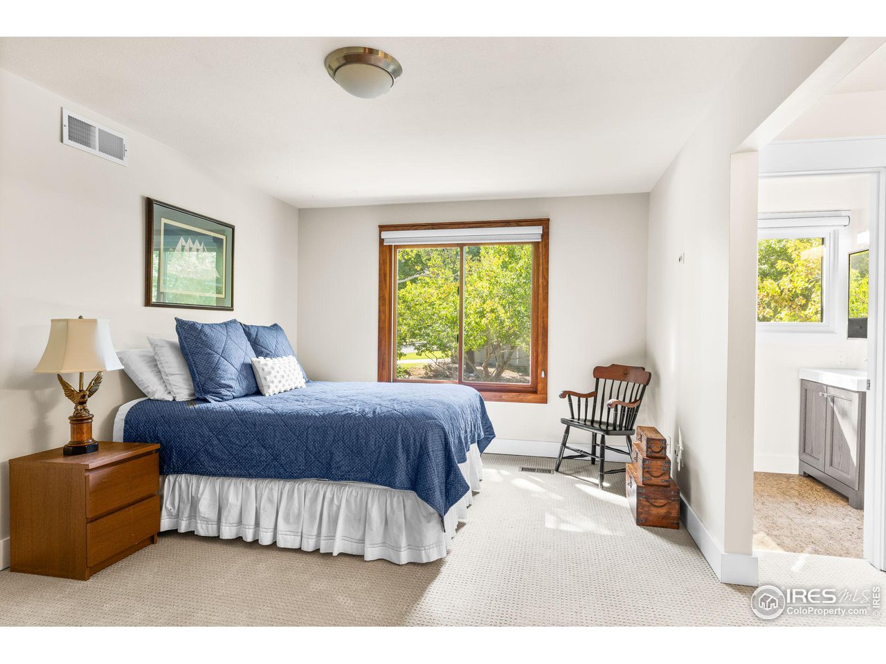 2545 Tamarack Avenue Boulder, CO 80304 - Photo 25 of 40 a living room with a bed furniture and a window