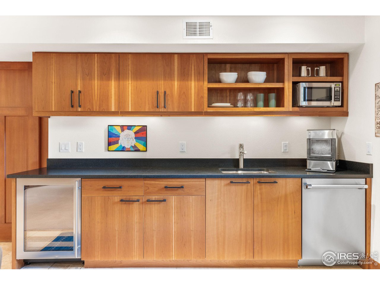 2545 Tamarack Avenue Boulder, CO 80304 - Photo 31 of 40 a kitchen with stainless steel appliances granite countertop a sink and cabinets