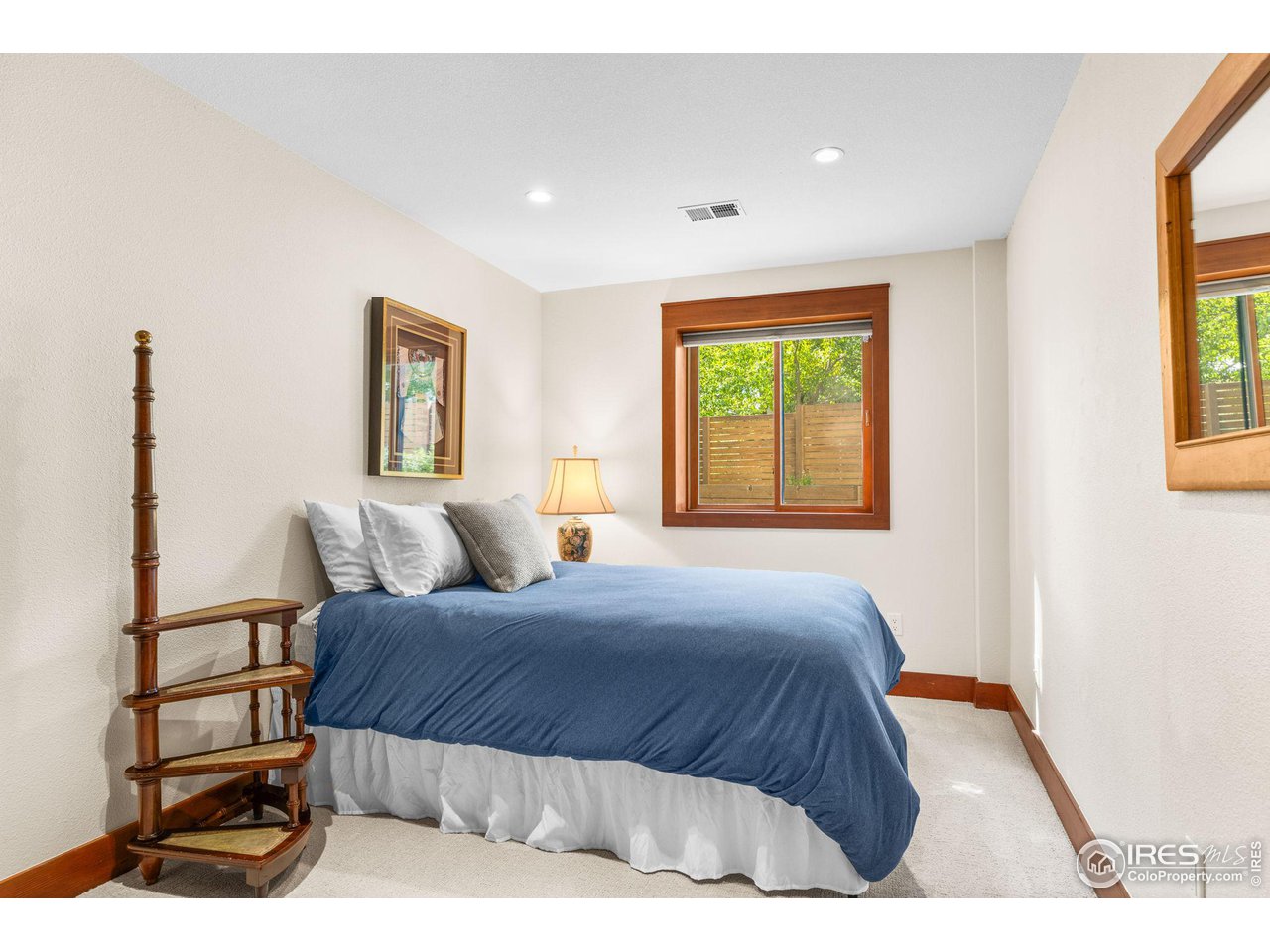 2545 Tamarack Avenue Boulder, CO 80304 - Photo 34 of 40 a bedroom with a bed and a window