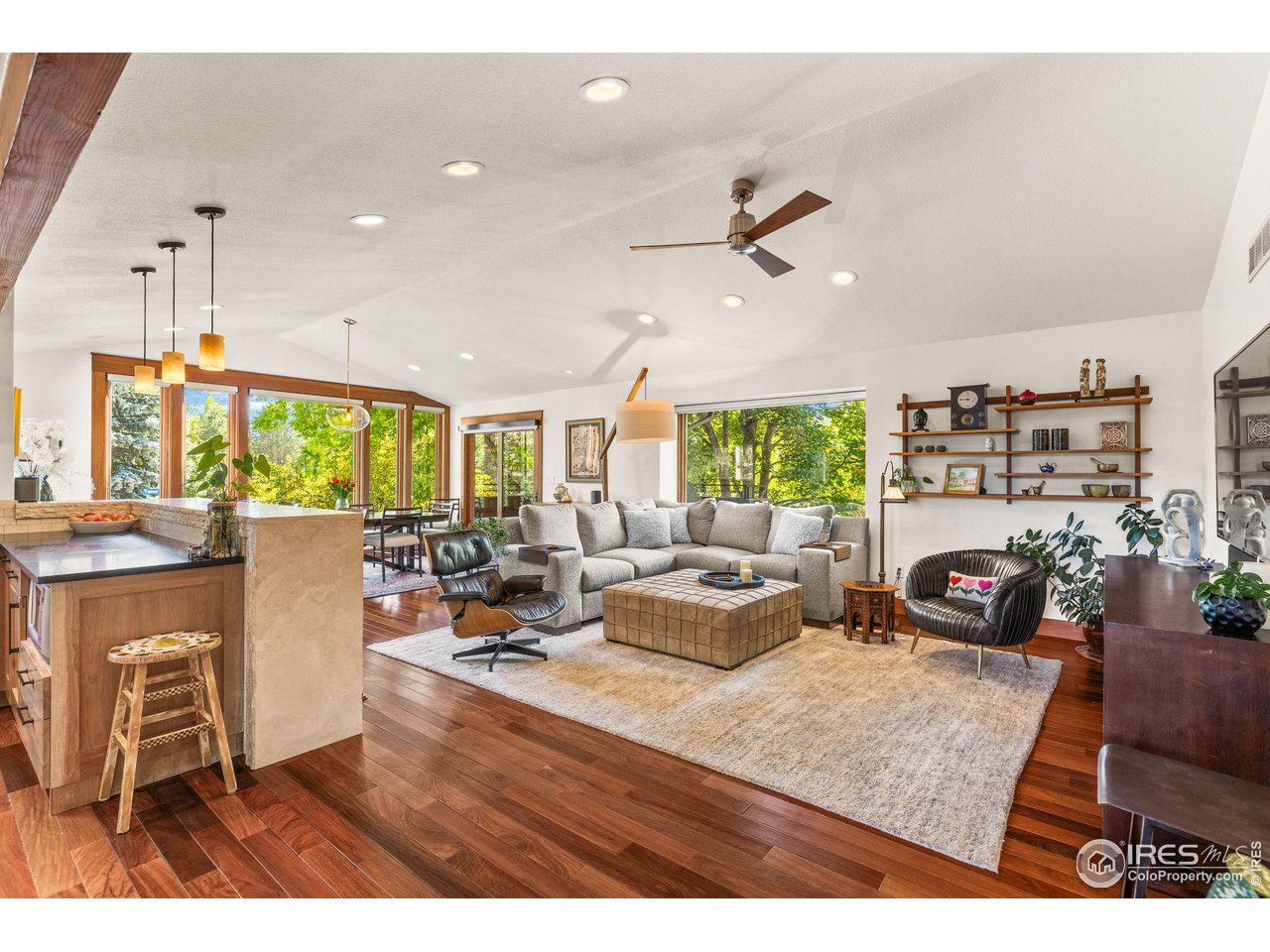 2545 Tamarack Avenue Boulder, CO 80304 - Photo 6 of 40 a living room with fireplace furniture and a large window