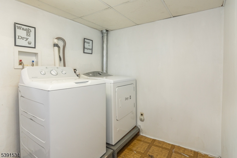 638 Clifton Avenue Clifton, NJ 07011 - Photo 20 of 21 a utility room with dryer and washer