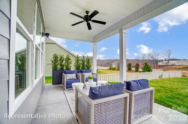 a balcony with furniture and garden view