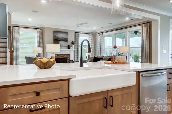 a kitchen with a sink and a refrigerator