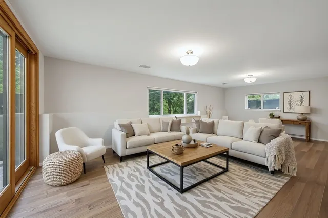 a living room with furniture and a window