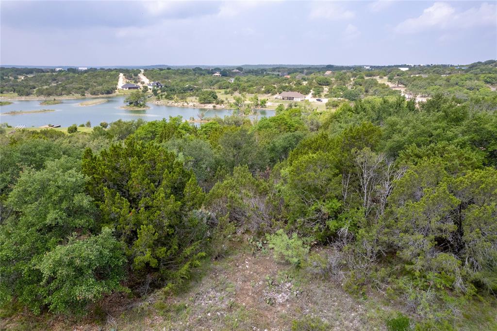 0 Anglers Point Bluff Dale, TX 76433 - Photo 20 of 35 a view of a lake with a building in the background